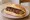 Loukaniko Mani: an illustration of pork and sausage on bread.