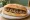 Loukaniko me Praso: an illustration of pork and sausage on bread.