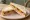 Luncheon Meat Sandwich: an illustration of pork, mustard, brown sauce and butter on white bread.