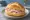 Lyoner Brötchen: an illustration of pork and mustard on kaiser roll.