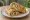 Malai Tikka Roll: an illustration of chicken, yogurt, onion, cilantro and more on naan.
