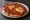 Manoushe Shakshouka: an illustration of egg, tomato, pepper, onion and more.