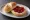 Marmeladenbrötchen: an illustration of butter and jam on kaiser roll.