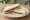 Marmite and Butter: an illustration of butter and marmite on white bread.