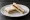 Marmite and Butter (Tea): an illustration of butter and marmite on white bread.