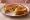 Marmite and Cheese: an illustration of cheddar cheese, marmite and butter on white bread.