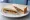 Marmite and Peanut Butter: an illustration of peanut butter, marmite and butter on white bread.