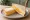 Mature Cheddar: an illustration of cheddar cheese and butter on white bread.