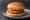 McAloo Tikki: an illustration of potato, tomato and onion on burger bun.