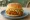 McDonald's China (麦当劳): an illustration of beef and chicken on burger bun.