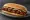 McDonald's McRib: an illustration of pork, bbq sauce, pickle and onion on hoagie roll.