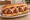 Meatball Sub: an illustration of beef, pork, mozzarella and marinara on hoagie roll.