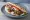 Melitzanokeftedes se Pita: an illustration of eggplant and onion on pita.
