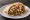 Meorav Shuk Mahane Yehuda: an illustration of chicken, onion, cumin and tahini on pita.