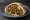 Meorav Yerushalmi (מעורב ירושלמי): an illustration of chicken, onion, cumin and tahini on pita.