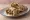 Meorav Yerushalmi b'Lafa (מעורב ירושלמי בלאפה): an illustration of chicken, onion, cumin and tahini.
