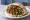 Meorav Yerushalmi b'Pita (מעורב ירושלמי בפיתה): an illustration of chicken, onion, cumin and tahini on pita.