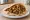 Meorav Yerushalmi Charif (מעורב ירושלמי חריף): an illustration of chicken, onion, cumin, pepper and more on pita.
