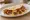 Meximelt: an illustration of beef, cheese and salsa on tortilla.
