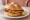 Michetta con Cotoletta: an illustration of veal, butter and lemon.