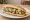 Midye Ekmek: an illustration of lemon and parsley on bread.