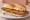 Milanesa de Cerdo: an illustration of pork and egg on baguette.