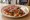 Mini İskender: an illustration of beef, tomato, yogurt and butter on pita.