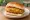 Mirchi Vada Pav: an illustration of pepper and potato on bread.