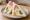 Mixed Fruit Sando (ミックスフルーツサンド): an illustration of strawberry, kiwi, banana, orange and more on shokupan.