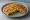 Mixed Veg Paratha: an illustration of potato, carrot, onion and cilantro on naan.