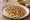 Mixed Veg Uttapam: an illustration of onion, tomato, carrot, cilantro and more.