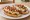 Mollete: an illustration of beans and cheese on telera roll.