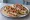 Mollete con Pico de Gallo: an illustration of beans, cheese, tomato, onion and more on telera roll.