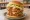 Mom's Touch — Double Thigh Burger: an illustration of chicken on burger bun.