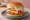 Mom's Touch — White Garlic Burger: an illustration of chicken, ham, cheese, garlic sauce and more on burger bun.