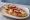 Montadito de Pulpo: an illustration of octopus, paprika and olive oil on baguette.