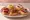 Montadito Variados: an illustration of pork, egg and fish on baguette.