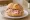 Mortadella Brötchen: an illustration of mortadella and butter on kaiser roll.