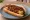 Mother-in-Law: an illustration of pepper and beef on hot dog bun.