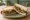 Mushroom Sandwich: an illustration of mushroom, cheese, butter, onion and more on white bread.
