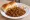 Mutton Bhurji Pav: an illustration of mutton, onion, tomato, pepper and more on bread.
