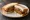 Mutton Cutlet Sandwich: an illustration of mutton, onion, pepper, ginger and more on white bread.