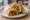 Mutton Frankie: an illustration of mutton, egg, onion, lemon and more on naan.