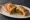 Mutton Puff: an illustration of mutton, onion, ginger, garlic and more.