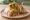 Mutton Seekh Roll: an illustration of mutton, onion, pepper, cilantro and more on naan.