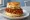 Nashville Hot Chicken Biscuit: an illustration of chicken, cayenne, pickle, honey and more on buttermilk biscuit.