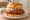 Nashville Hot Chicken (National Trend): an illustration of chicken, cayenne, pickle and coleslaw on white bread.