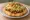 Navajo Taco: an illustration of beef, beans, lettuce, tomato and more.
