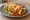 New Mexico Burrito: an illustration of pork, beef, beans and cheese on tortilla.