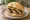 Nürnberger Bratwurst: an illustration of mustard on kaiser roll.